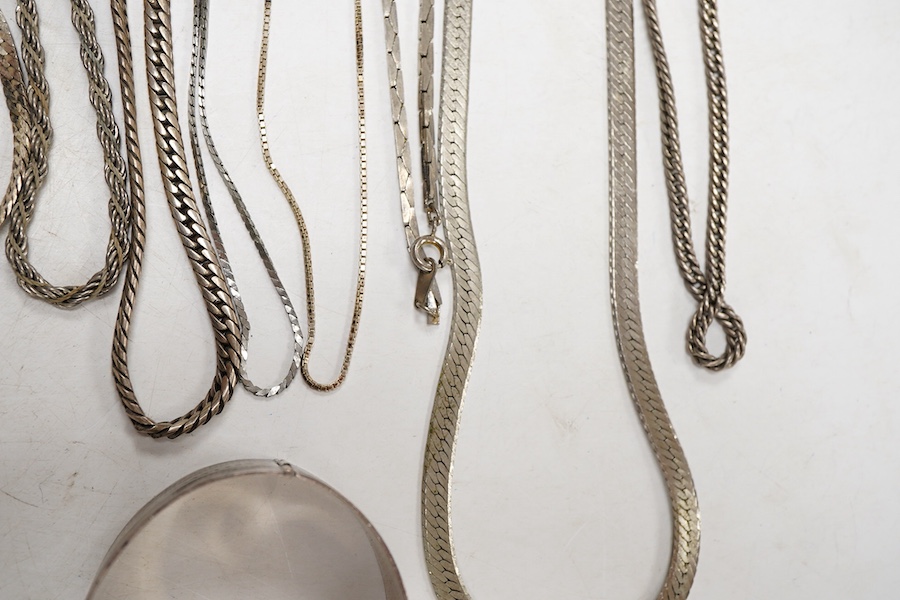 Two white metal bangles, one inscribed 'sterling silver' the other '925', together with a silver Uno A Erre chain, four other 925 chains, one curb link and four other white metal chains, longest approx. 69cm.